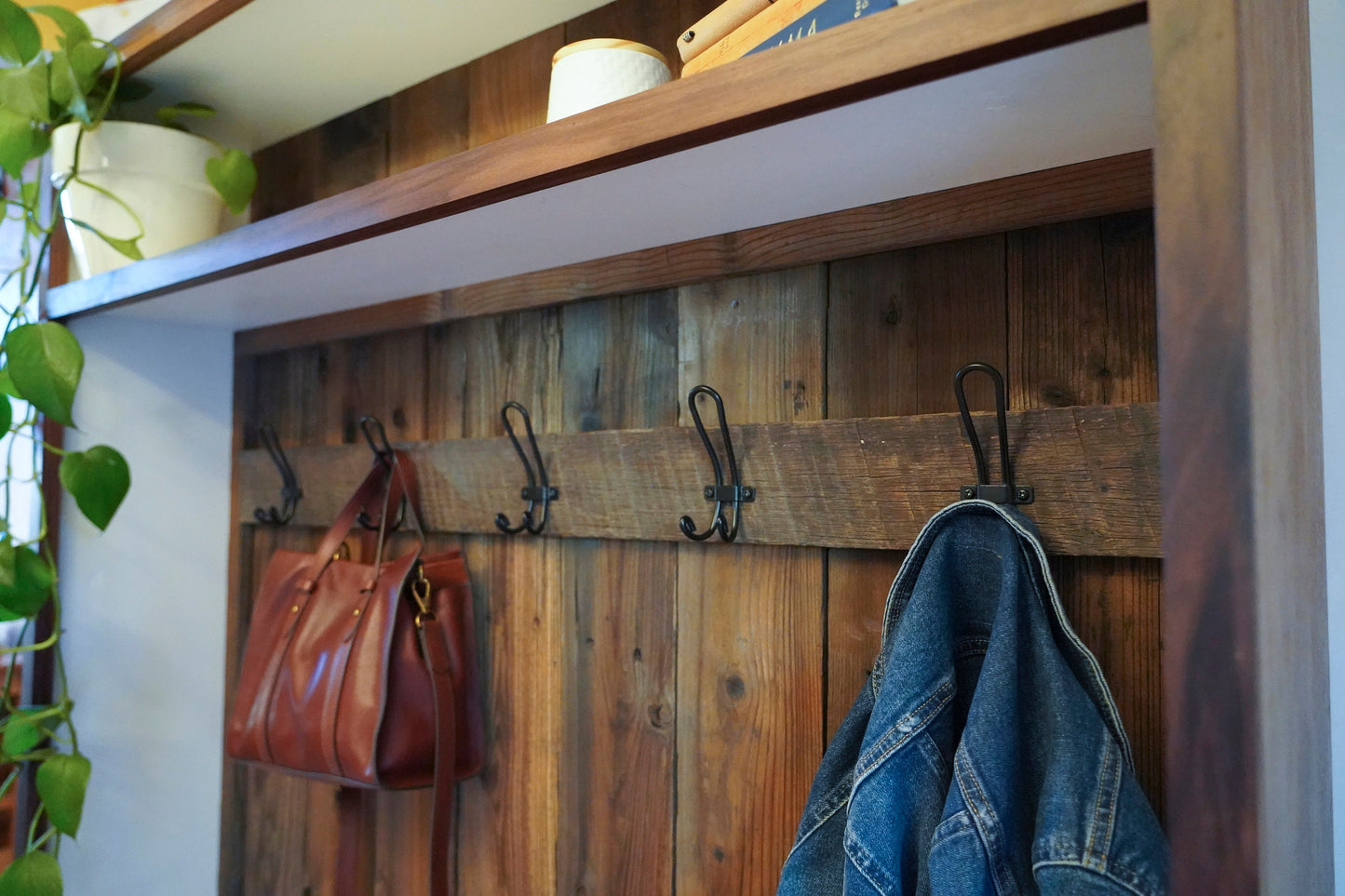 close_up_hooks_on_rustic_barn_wood_back_panel