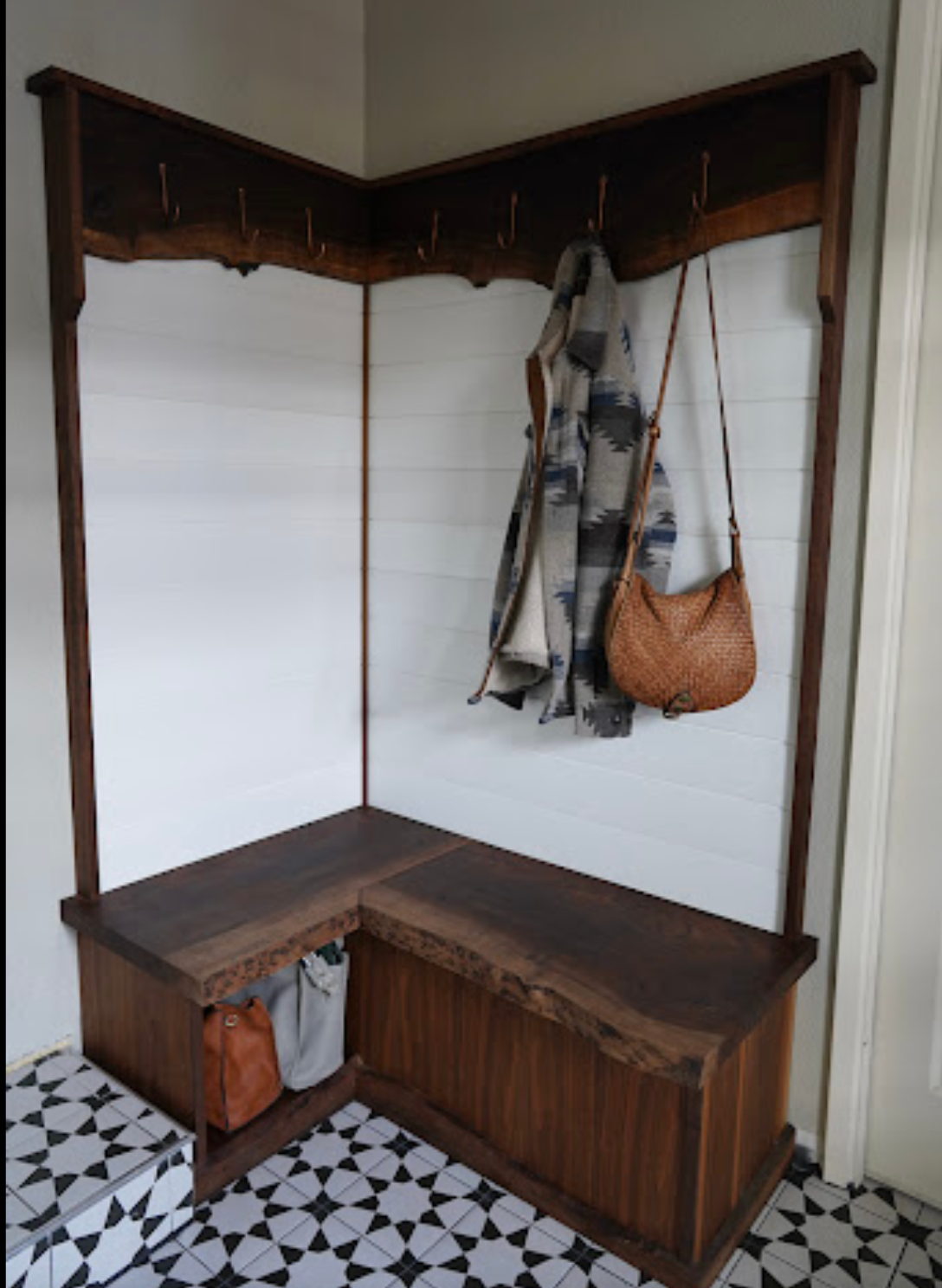 organized_hall_tree_with_jackets_bags_and_walnut_finish