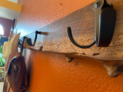 angled_view_coat_rack_with_hooks_and_purse