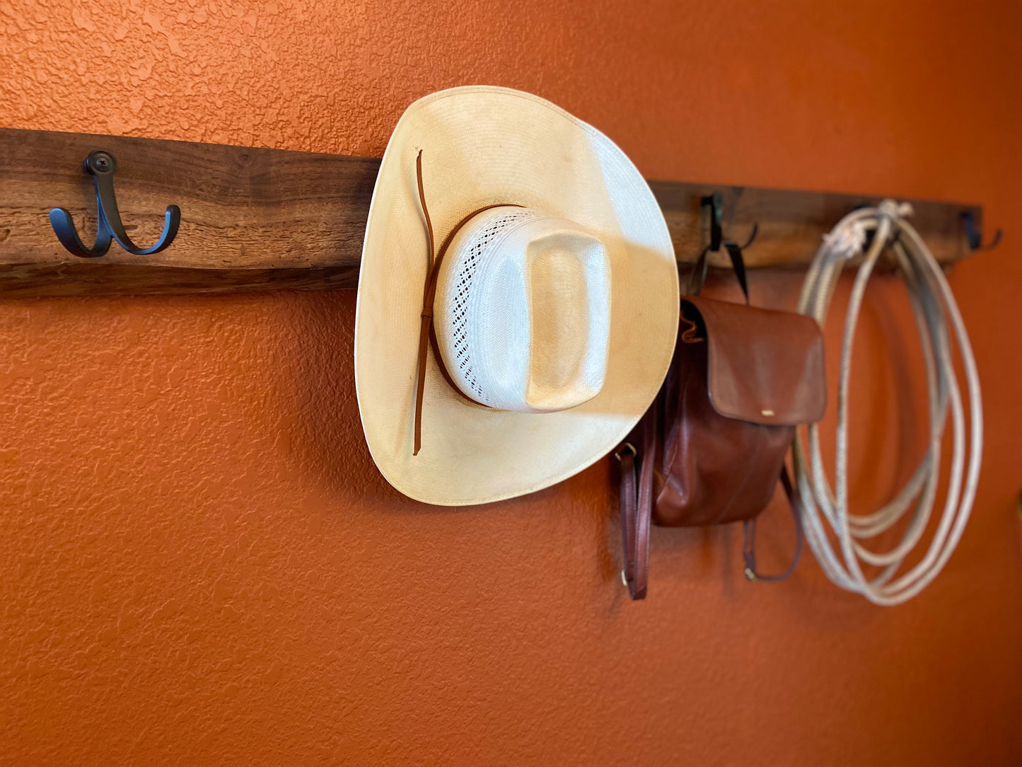 black_walnut_live_edge_coat_rack_on_orange_wall