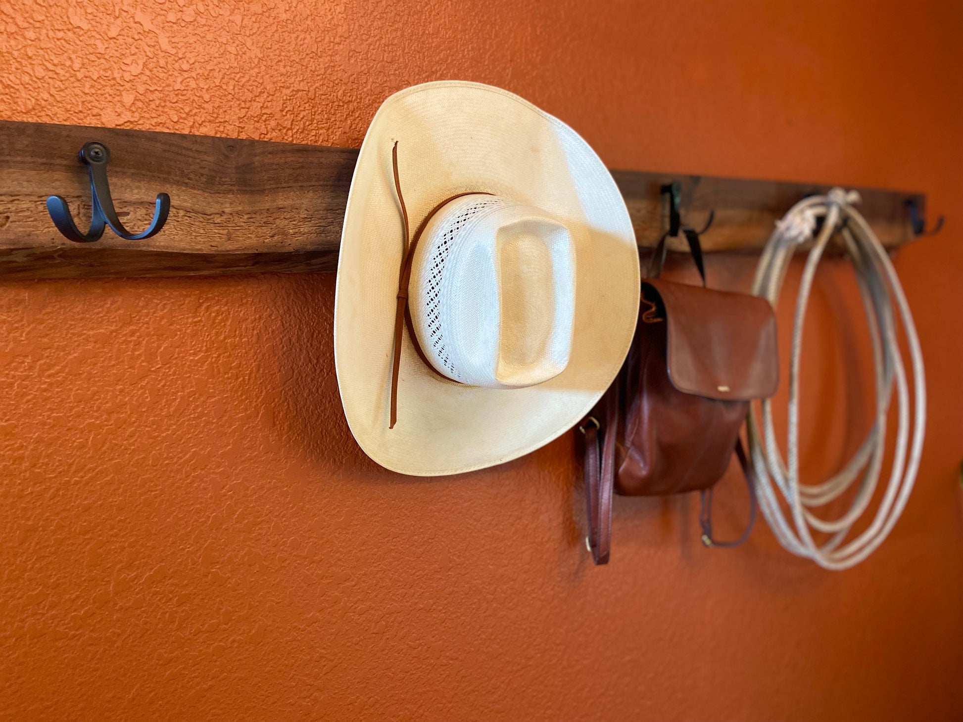 black_walnut_live_edge_coat_rack_on_orange_wall
