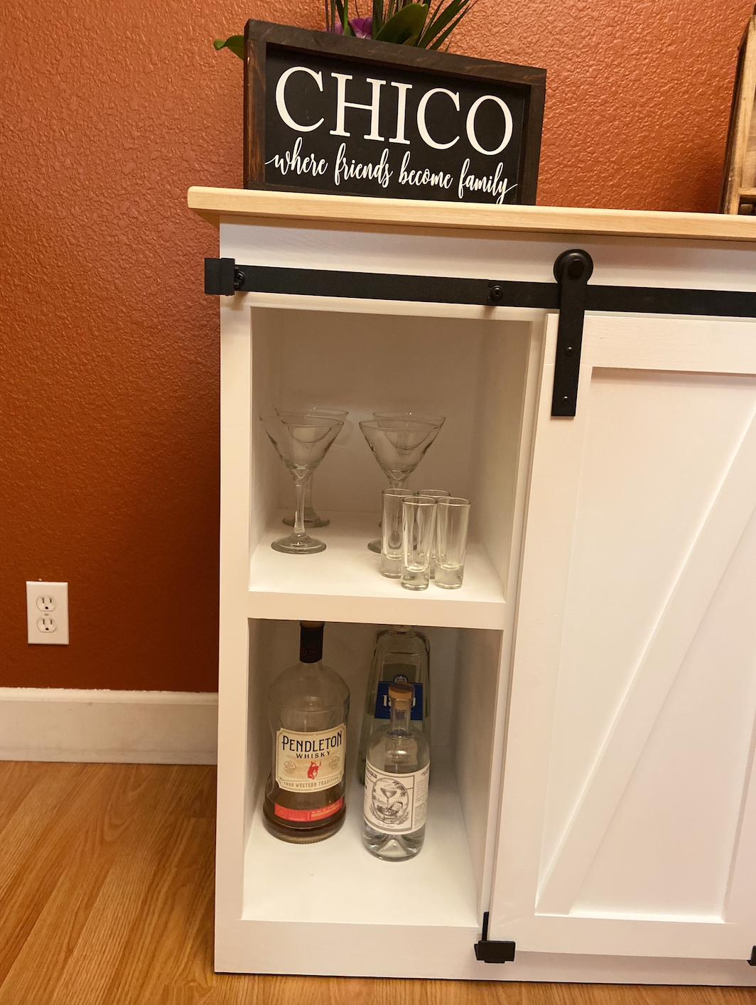 open_barn_doors_showing_inner_shelves_of_cabinet