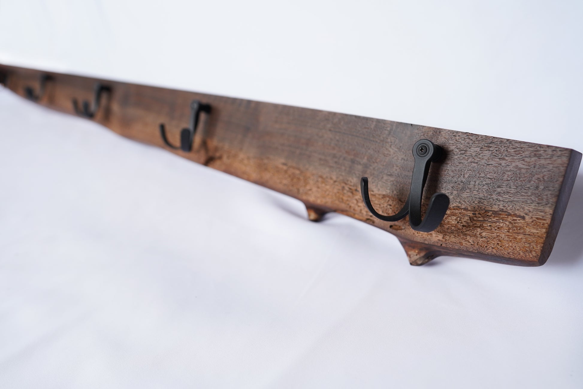 side_profile_of_walnut_wood_hook_rack
